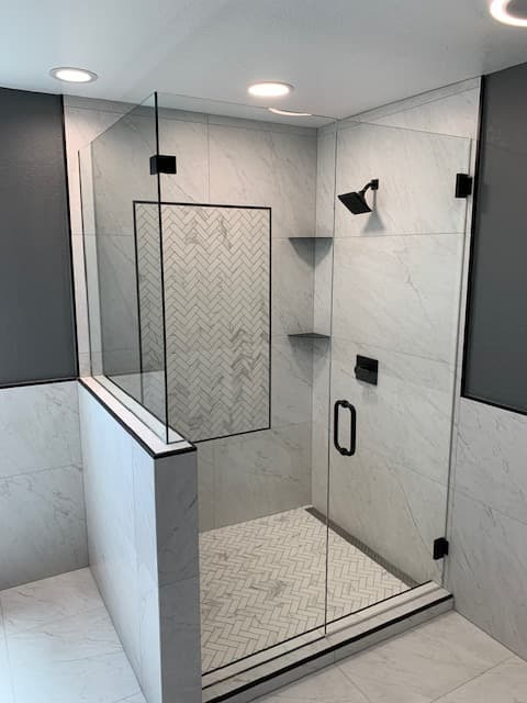 Bathroom glass enclosure reflecting natural light