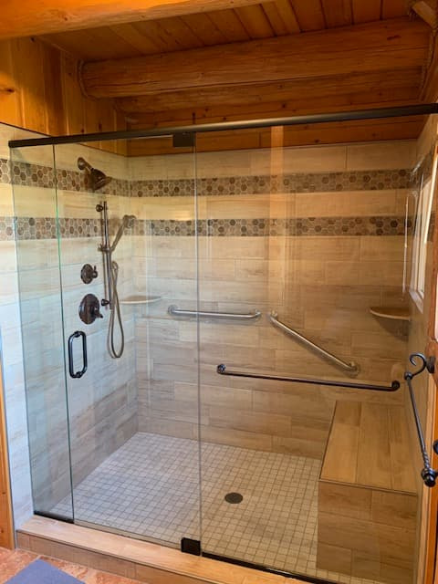 Frosted glass shower partition beside toilet area